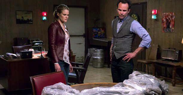 Ava (Joelle Carter) and Boyd (Walton Goggins) survey the damage of the season in 'Ghosts'