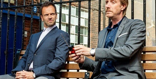 Sherlock (Johnny Lee Miller) and Mycroft (Rhys Ifan) bond in a Holmes-ian way in the second season premiere